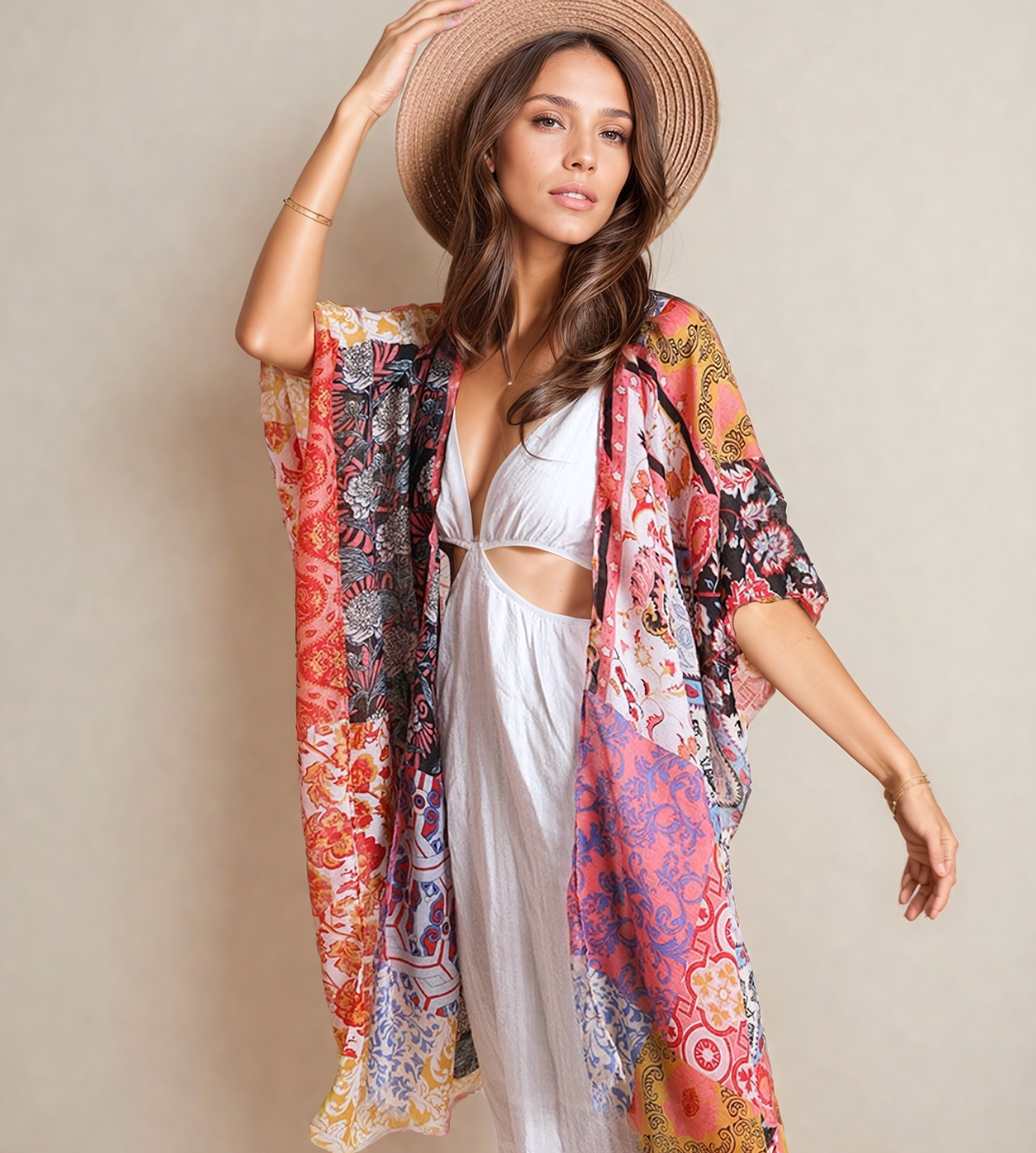 Woman wearing a colorful floral kimono and white dress against a beige background